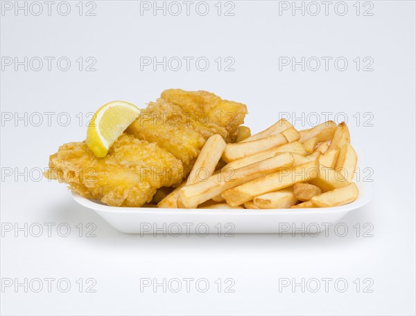 Food, Cooked, Fish, A portion of battered deep fried huss with a slice of lemon and potato chips
