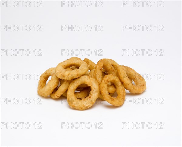 Food, Cooked, Vegatables, Battered fried onion rings on a white background.