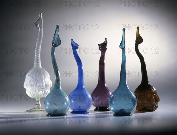 Six perfume sprinklers; cut glass of various colours; Persian; 19th century.