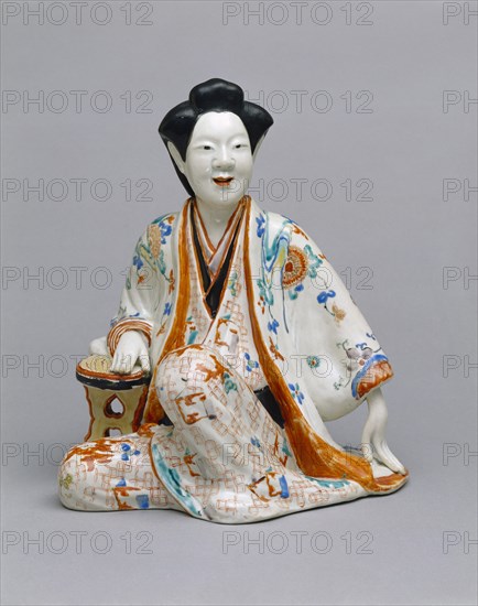 Statuette représentant une courtisane assise