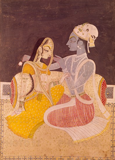 Radha assise près de Krishna