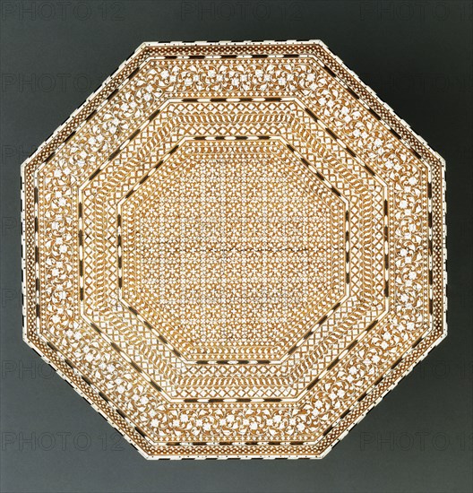 Small table, octagonal top with eight legs. India, 1881