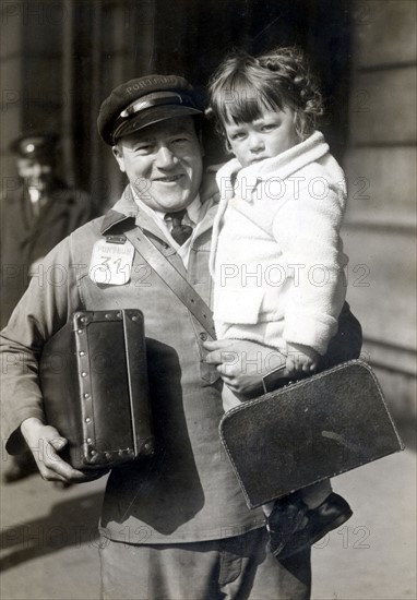 A porteur in a railway station during the Easter Holidays period