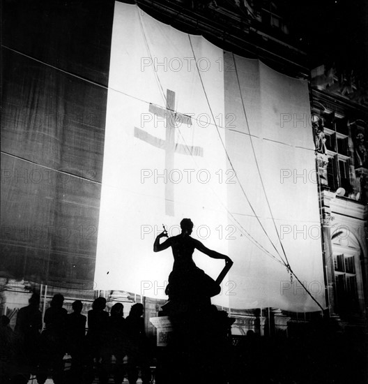 The French flag with the Lorraine Cross, during the Liberation of Paris (August 1944)