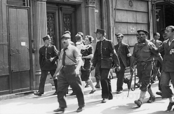 Civilians and soldiers  in the streets of Paris during the Liberation (August 1944)