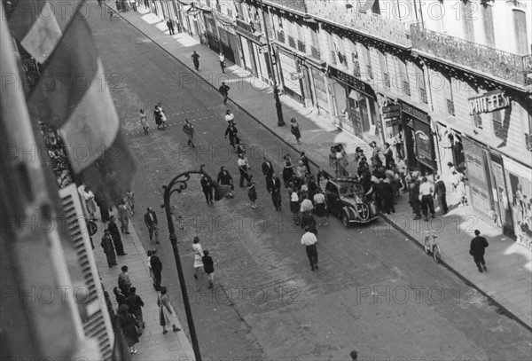 Civilians in a street of Paris, during the Liberation (August 1944)