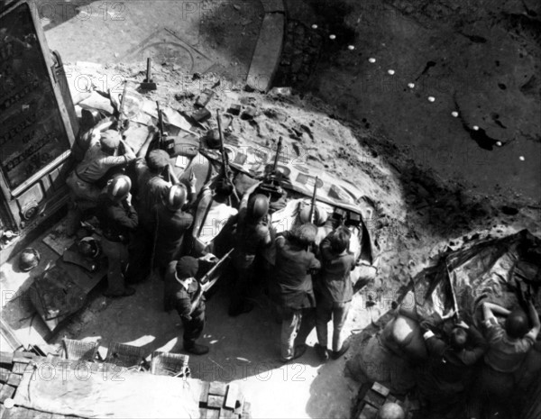 Members of the F.F.I. behind a barricade, during the Liberation of Paris (August 1944)