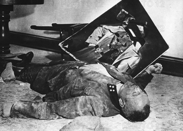 A general of the Volksturm has committed suicide in front of Hitler's portrait