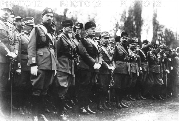 King of Italy, Mussolini and Marshal Badoglio attending a military ceremony