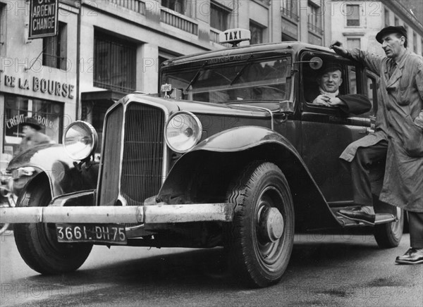 A G7 taxi parked at Bourse square in Paris