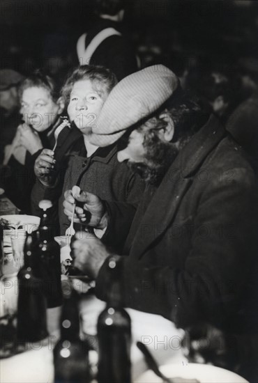 Homeless people during a Christmas eve dinner offered by the Salvation Army, 1931