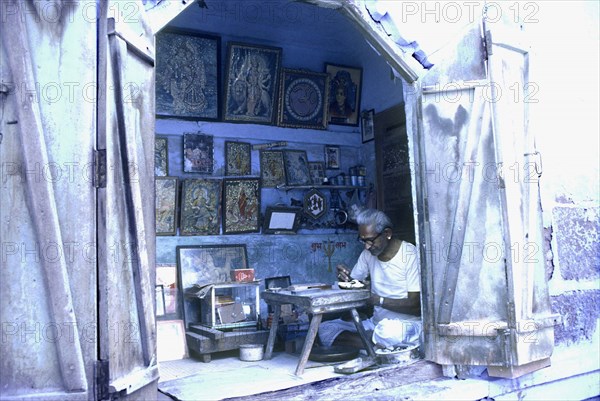 Artisan at work decorating religious icons,
Jodhpur, Western Rajasthan, India.