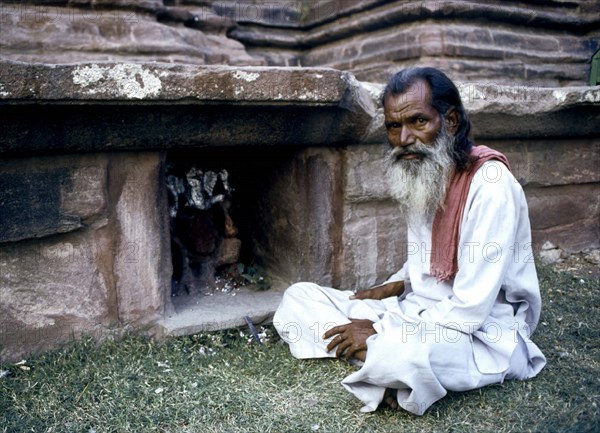 Mandore Gardens, holy man making an offering to the Hindu God Ganesh