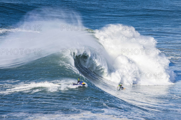 December 13, 2021, Nazare, Portugal: The French surfer, Justine Dupont, rides a wave during the TUDOR Nazare Tow Surfing Challenge presented by Jogos Santa Casa, at Praia do Norte in Nazare.
