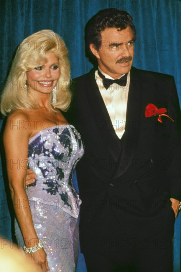BURT REYNOLDS with LONI ANDERSON at the Emmy Awards in 1991. (Credit Image: © Globe Photos/ZUMAPRESS.com)