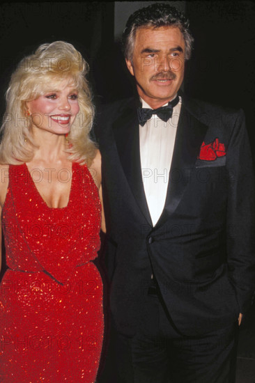 BURT REYNOLDS with LONI ANDERSON at the Golden Globe Awards in 1991. (Credit Image: © Globe Photos/ZUMAPRESS.com)